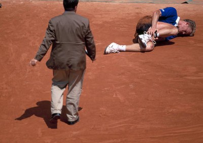 Wayne Ferreira of South Africa after falling to the ground with an- Old Photo