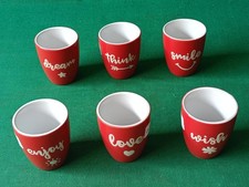 SET 6 TAZZINE BIALETTI BICCHIERI IN PORCELLANA ROSSA CON VARIE SCRITTE. CX80