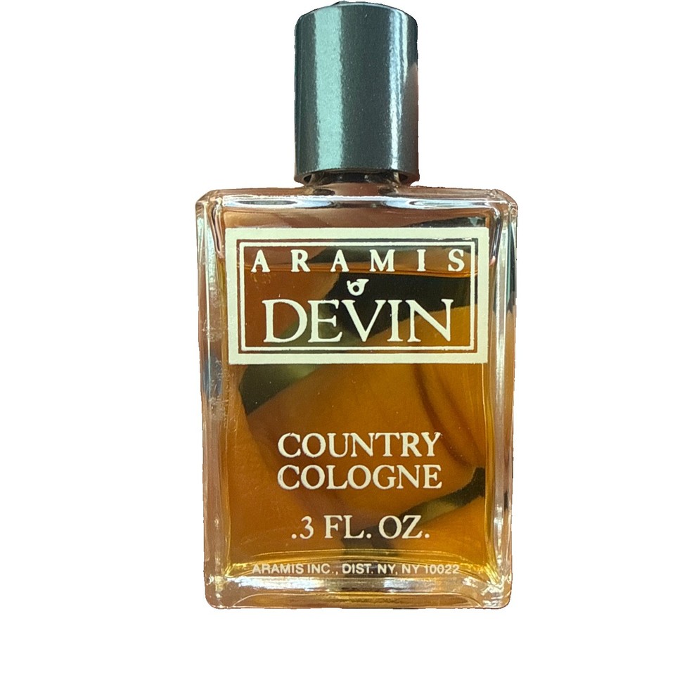 A sealed, travel-size bottle of Aramis Devin — a discontinued 1970s aromatic fougère that smells like a hiking trip through a pine forest in a tweed jacket.