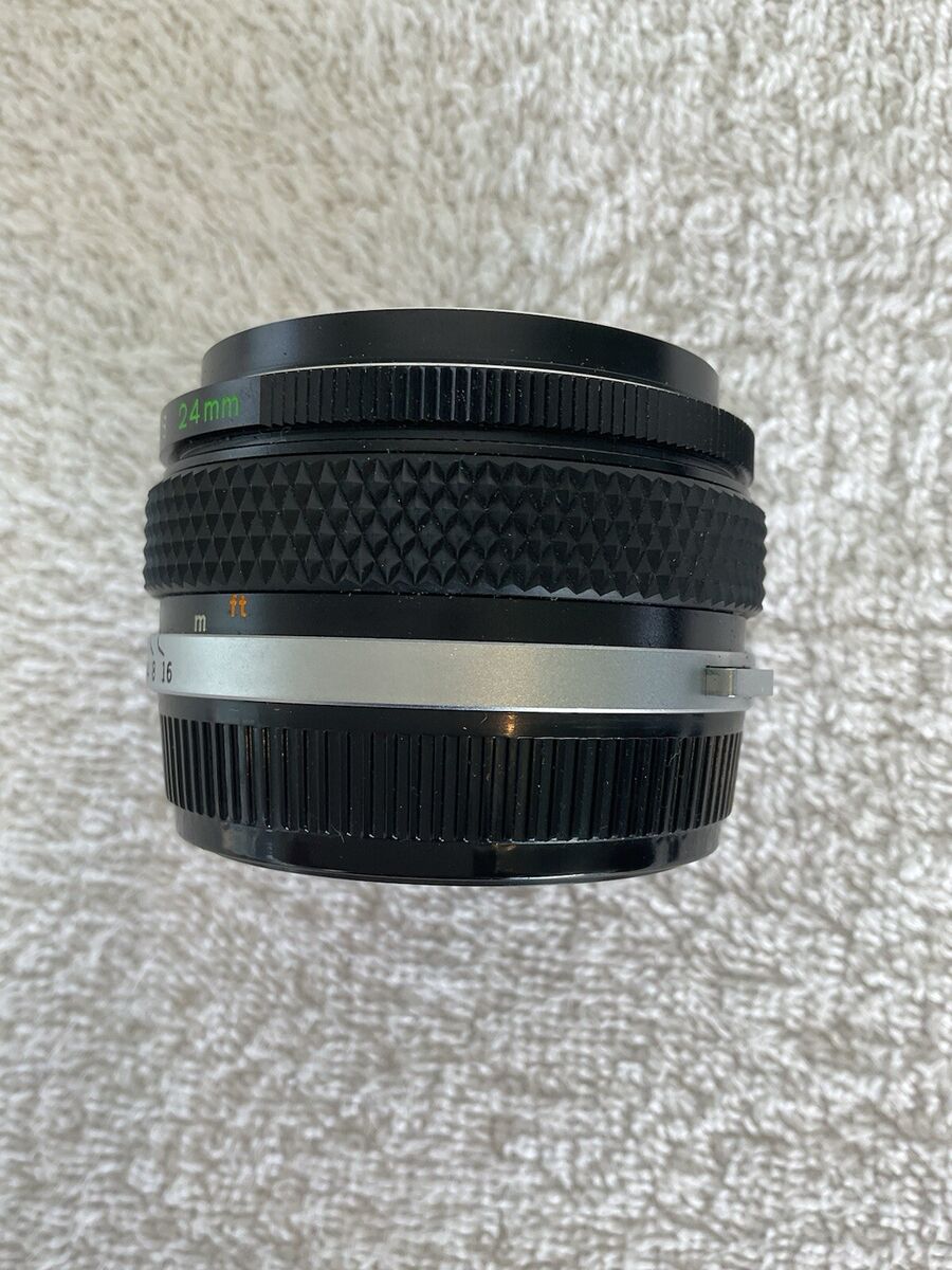 Vintage Olympus OM-System 24mm f2.8 Zuiko Auto-W Camera Lens Vintage Olympus OM-System 24mm f2.8 Zuiko Auto-W Camera Lens