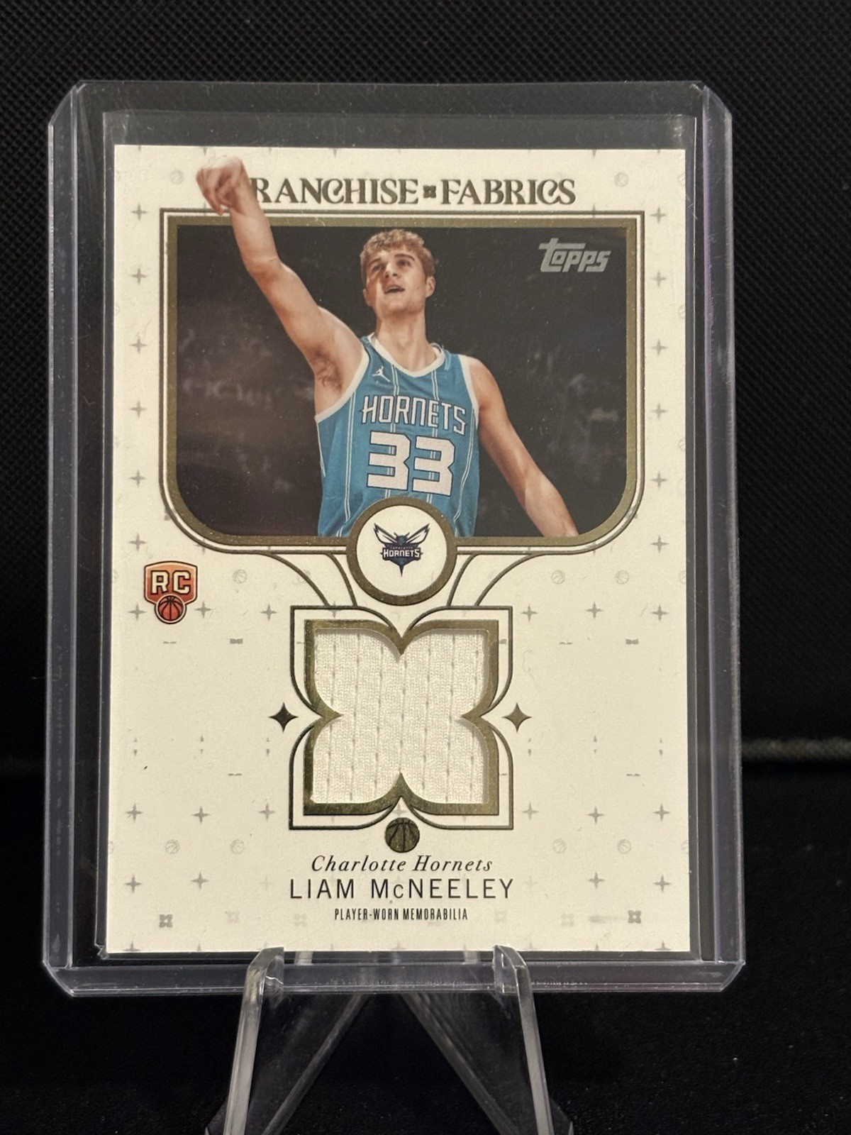 2025-26 Topps - Franchise Fabrics Liam McNeeley #FF-LM (MEM, RC)