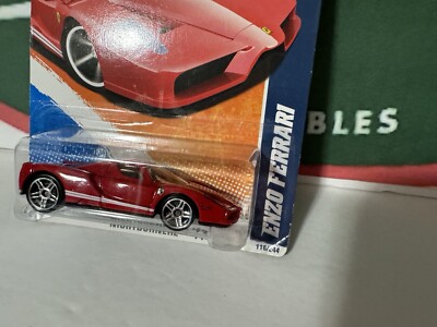 2011 HOT WHEELS RED ENZO FERRARI, HW #116 W/ GREEN LANTERN CARD
