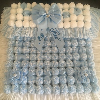 grey pom pom baby blanket