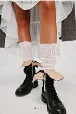 Free people all about bows leg warmers