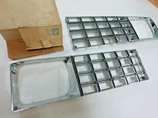 New GM 1982 Oldsmobile Omega front Grille combo headlight bezel NOS left right