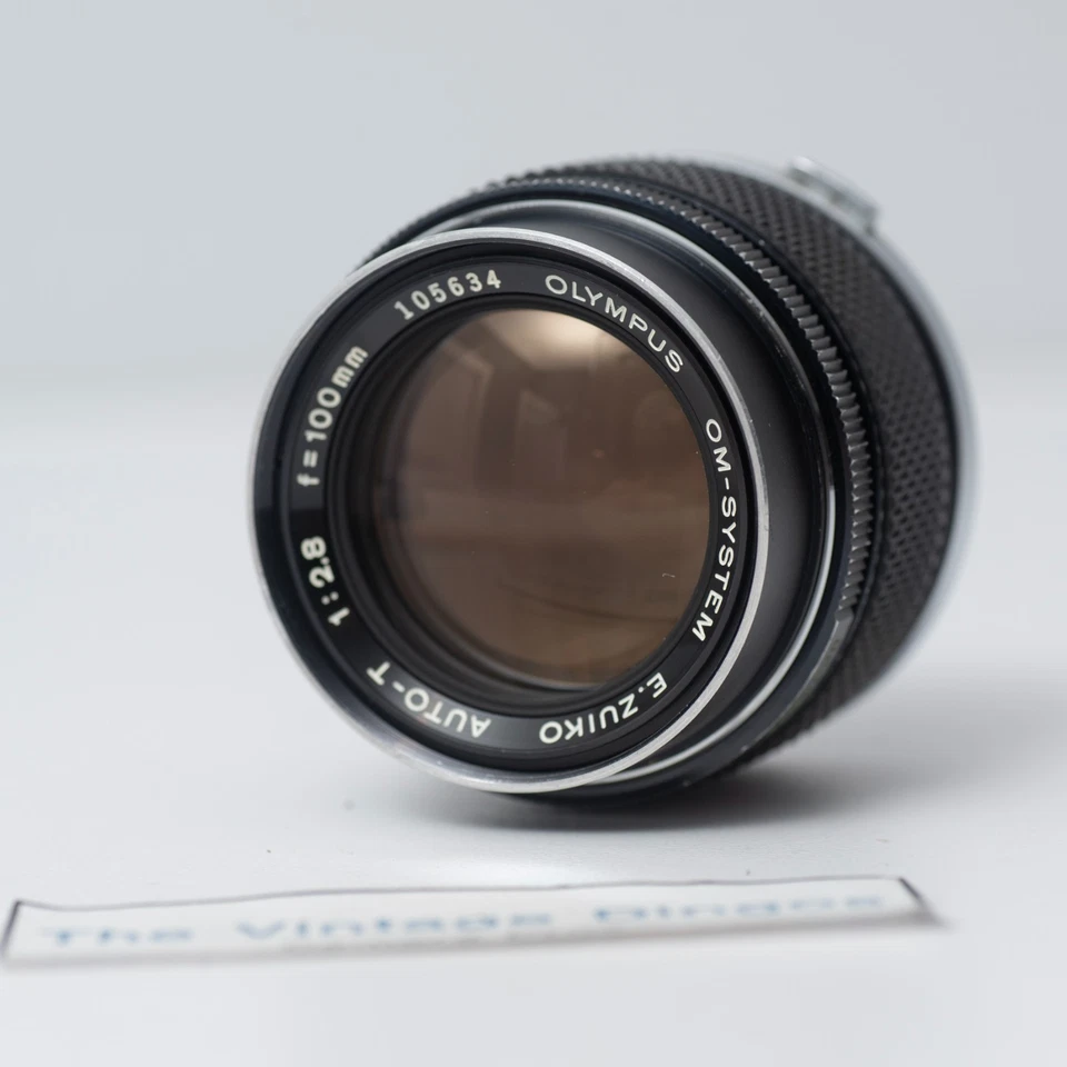 Lente Olympus OM-SYSTEM E.Zuiko Auto-T 100 mm f/2,8 MF con tapas + filtro Foto 3 de 4
