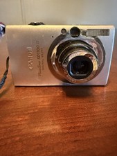 Canon PowerShot SD1100 IS 8MP CCD Digital Cam...