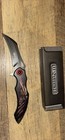WarTech Black/Red/Silver Aluminum Handle Hawkbill Plain Blade Manual Pocketknife — photo 1