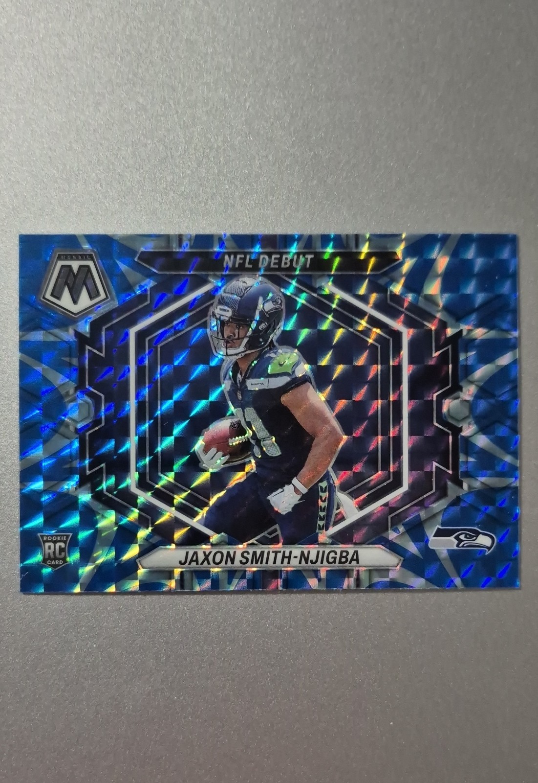 2023 Panini Mosaic - Nfl Debut Jaxon Smith-Njigba #ND-12 Reactive Blue Mosaic RC