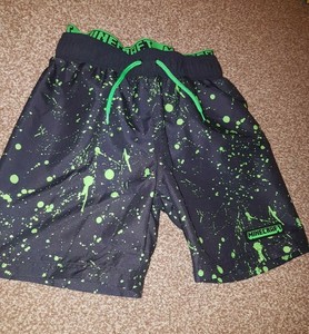 black and green swim trunks