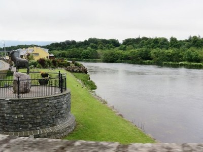 Photo A3 River  Laune  and  the  statue  of  King  Puck  to  left Killor c2013