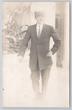 Real Photo Man in Studio Leaning on Wall Hand on Hip Postcard  RPPC