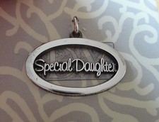 Sterling Silver 16x24mm Cut Out Oval says Special Daughter Charm