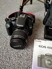 Canon slr digital camera in perfect condition. With tripod stand/ manual/ discs.