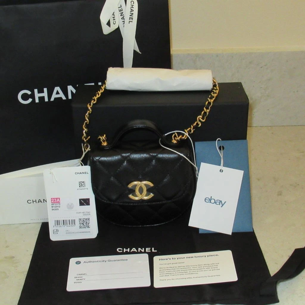 NEW 23A Chanel Black Shiny Aged Calfskin Clutch with Chain Handle Vanity Bag  WOC