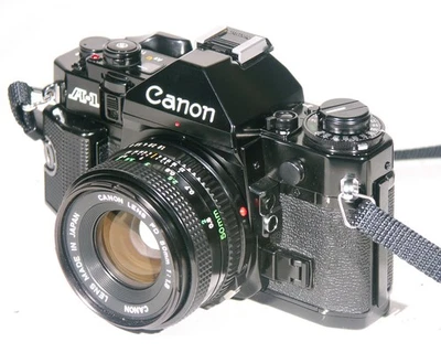 CANON A-1 GEPFLEGTE SPIEGELREFLEXKAMERA SLR MIT CANON OBJEKTIV - Bild 1 von 4