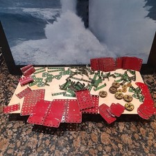 Meccano plates , flanged wheels , angled strips , etc. Red and green.