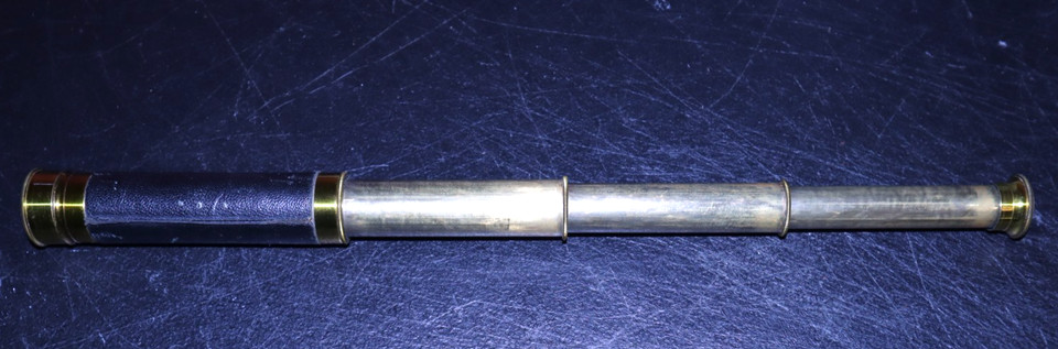 A leather-wrapped brass spyglass with the extra cred of a 'Made in France' mark — the kind of find that feels curated rather than mass-produced.