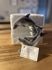 Beautiful, collectible dolphin figurine by MiYo Porcelain Creations