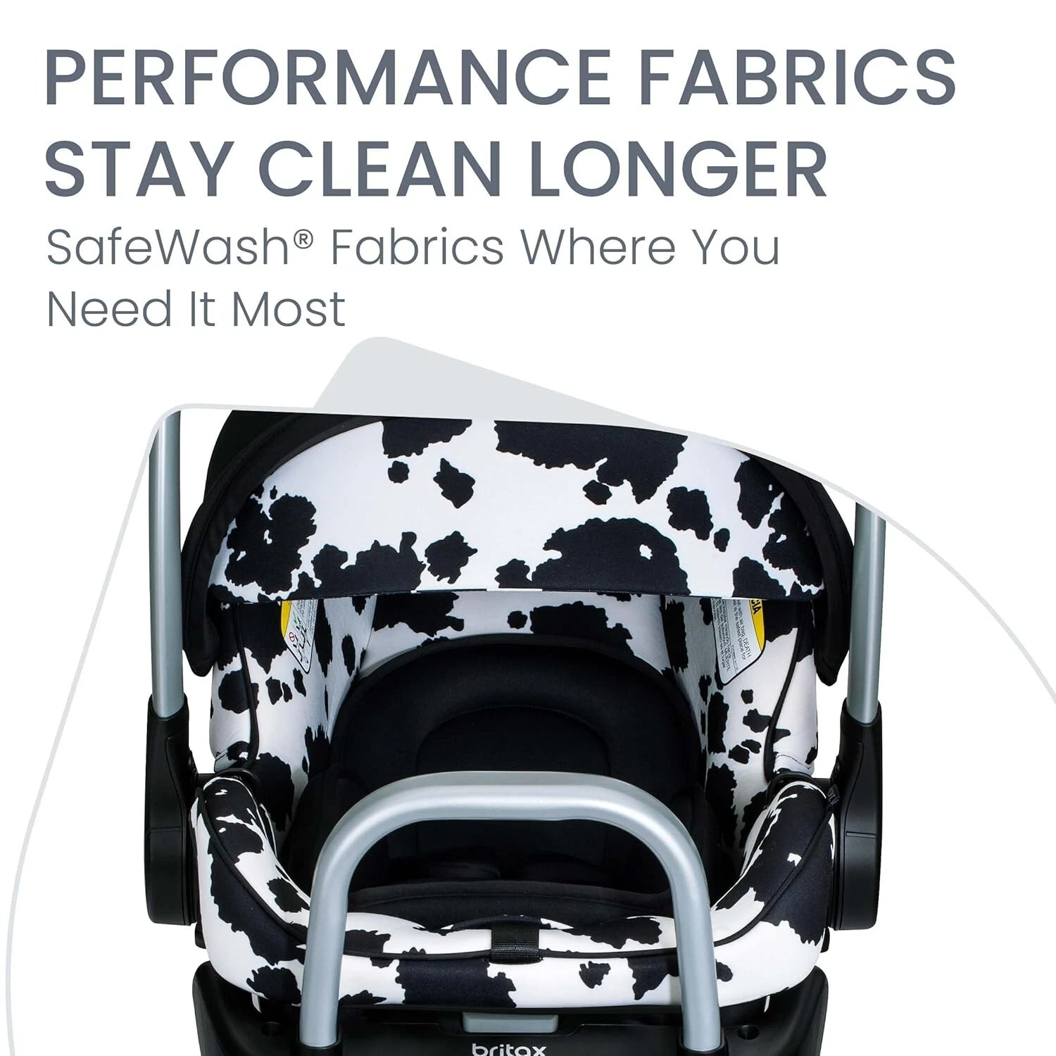 Britax Willow SC infant car seat with black and white cow print pattern and gray metal handle, SafeWash® fabric visible.