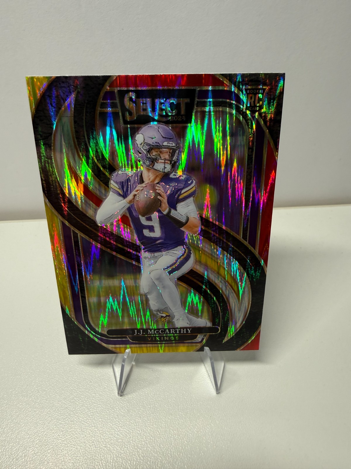 J.J. McCarthy 2024 Panini Select Premier Level Red & Yellow Prizm Shock RC #134