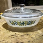 Vintage Glasbake milk glass casserole dish with blueberry pattern and lid.