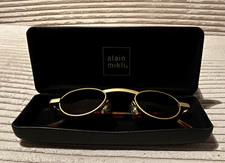 alain mikli Damen Sonnenbrille oval gold Schi...
