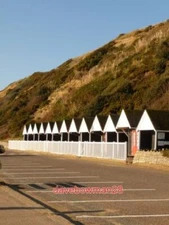 PHOTO  BOURNEMOUTH: THIRTEEN BEACH HUT GABLES CATCH THE SUN THE BRIGHT SUNSHINE