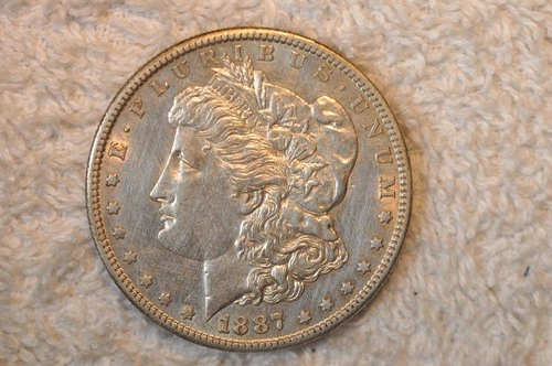1887-S  AU  MORGAN DOLLAR
