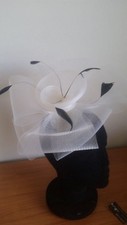 STUNNING IVORY CRINOLINE FASCINATOR WITH FLOWER, FEATHERS  LOOPS, RACES