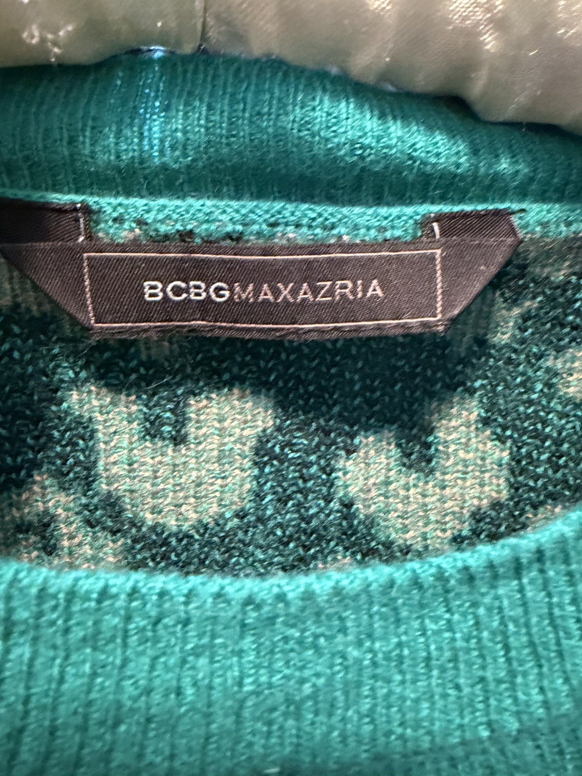 Beautiful BCBG sweater with a golden leopard across the front and back.