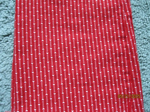 Red with lines of white hearts from General Fabrics