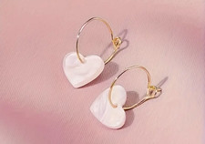 Acrylic pale pink heart on gold hooped drop earrings, both are 1.7cm in size