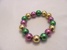 PLASTIC PURPLE, GREEN AND GOLD  STRETCH MARDI GRAS BRACELET