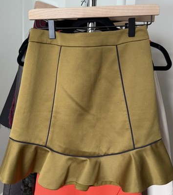 BCBGmaxazria khaki skirt with blue piping and ruffle hem. Size: XS