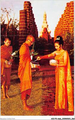 AICP3-ASIE-0386 - A Thai - Young Girl Is Making Merit By Giving Foods To Th