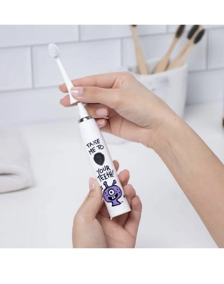 Cepillo de dientes eléctrico hecho por dentistas con 2 cabezales de repuesto y cargador púrpura Foto 2 de 4