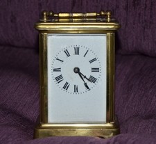Antique French brass carriage clock in working order with original key