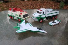 Lot of Four Hess Oil Toy Vehicle Fighter Jet Ladder Truck Racecar