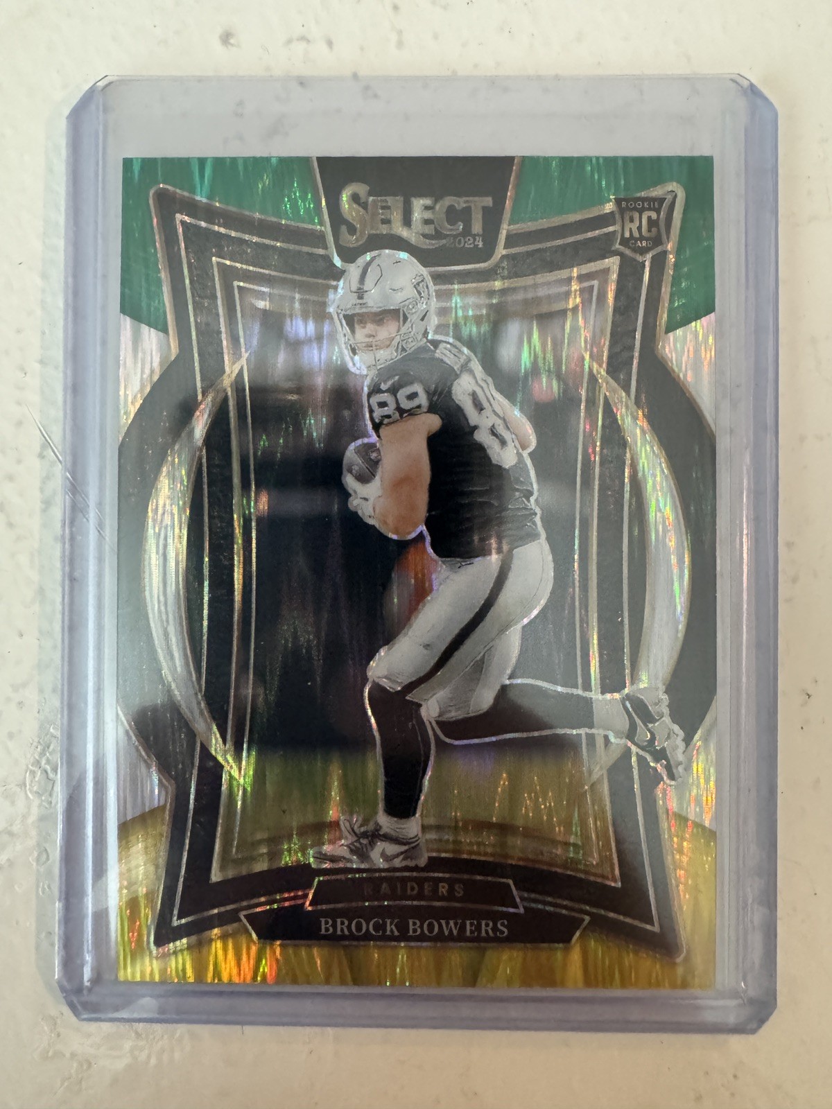 2024 Panini Select Brock Bowers Green & Yellow Prizm Shock #31 Rookie RC Raiders
