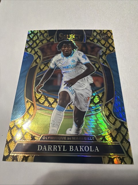 2025-26 Panini Select Ligue 1 Darryl Bakola Gold Dragon Scale Terrace RC /10
