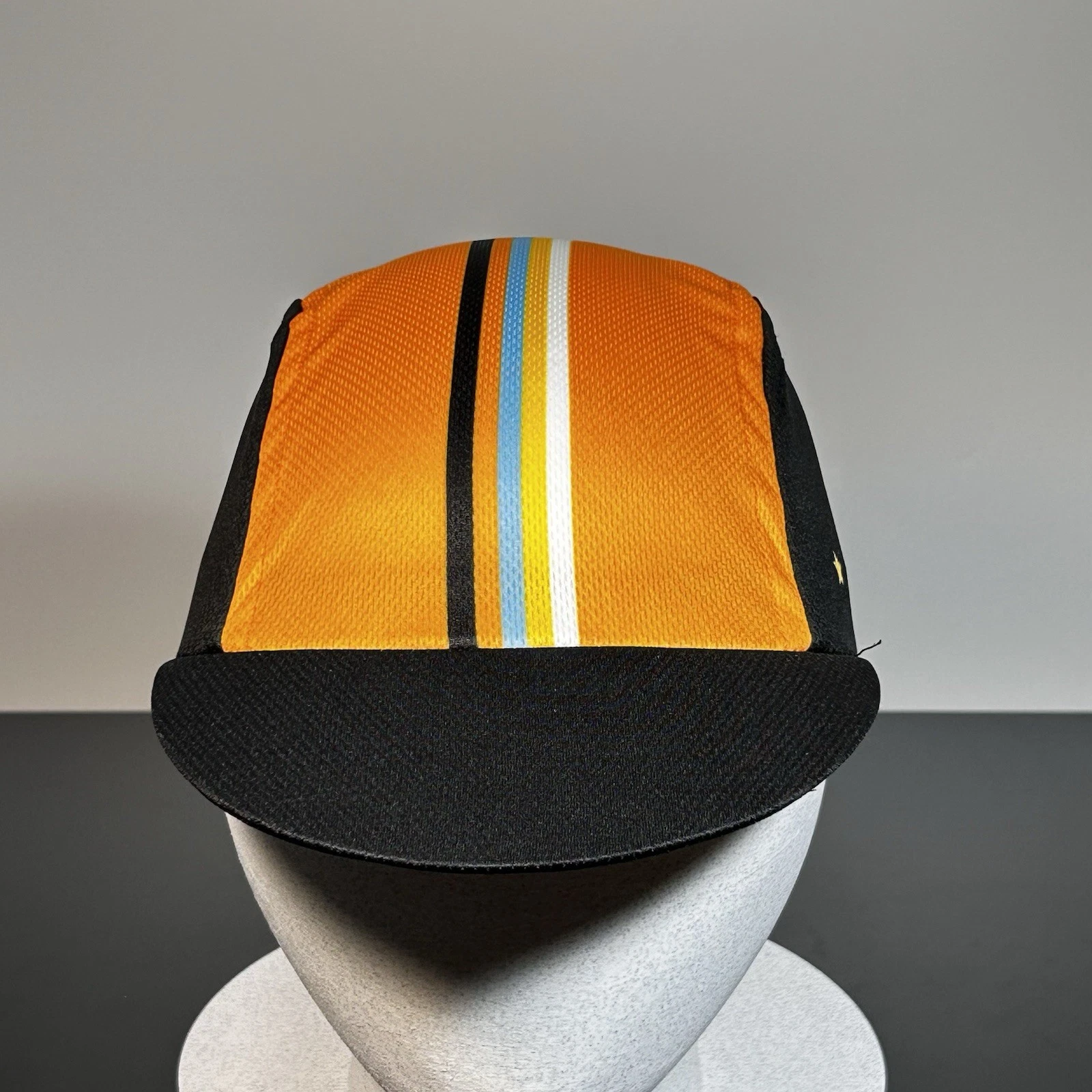 O.S. Primal Wear Cycling Cap Hat Black Orange Blue Stripes One Size Fits All