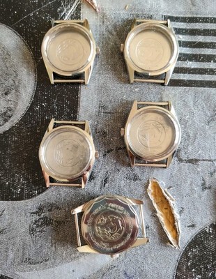 Konvolut 5 Uhrengehäuse ENICAR Vintage mit Glas Krone signiert Swiss Watch Case