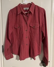 Demin or heavy cotton button-up shirt under the brand name Authentic Clothing.