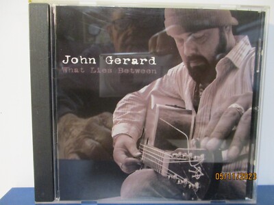 John Gerard - What Lies Between - CD - MINT condition - 25-1939