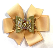 Beautiful Gold bow with additional faux leather bow with gold jeweled crown.