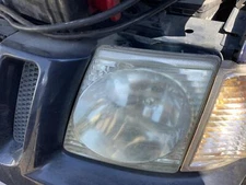 Used Left Headlight Assembly fits: 2003 Ford Explorer Sport Trac Left Grade A
