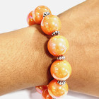 QVC Dark Iridescent Orange Bead Stretch Bracelet Silvertone — photo 4