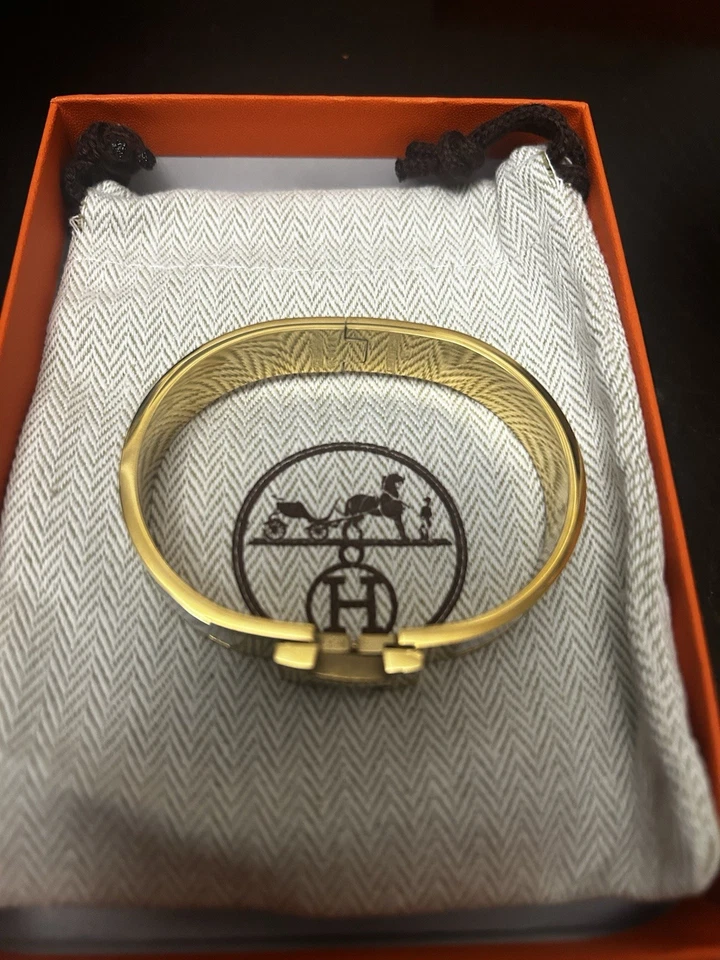Pulsera Damas Hermes Clic H Chapada en Oro Blanco y Amarillo - Excelente Estado Foto 2 de 4