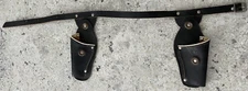 A PAIR OF TOY WESTERN REVOLVER HOLSTERS - SUIT CRESENT SHERIFF SET - VERY GOOD